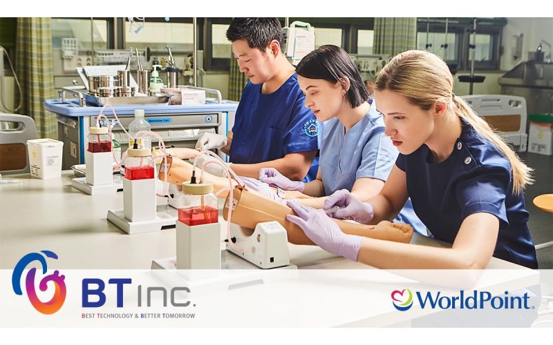 medical students practicing IV insertion on skill trainers