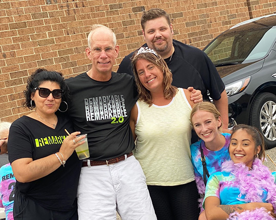 WorldPoint employees posing together at a company event