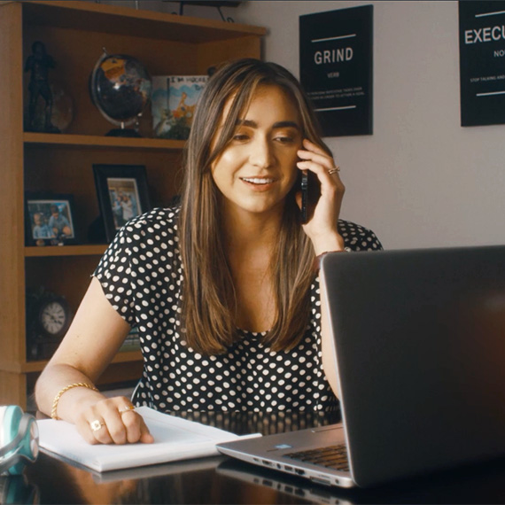 WorldPoint Regional Sales Manager Rachel Weber sitting at a desk, on the phone